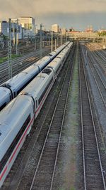 High angle view of train at railroad station against sky