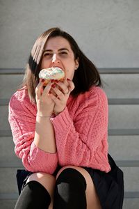 Full length of woman eating food