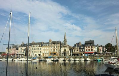Boats moored at harbor