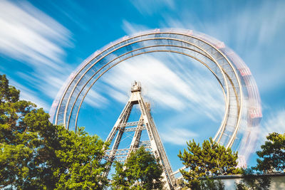 Low angle view of ferris wheel against sky