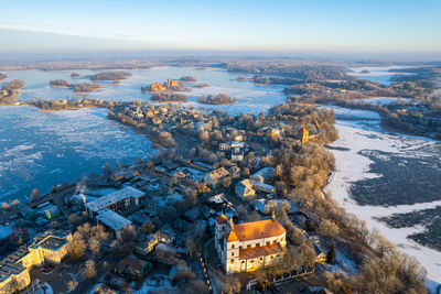 Aerial winter sunny day view of frozen galve lake in trakai, lithuania