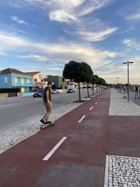 Skateboarding by the promenade