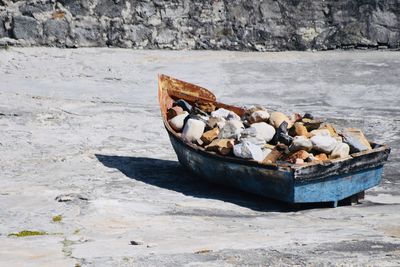 Stack of garbage on rocks at beach