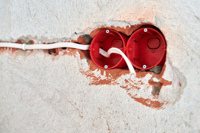 New electrical wiring installation, plastic socket box, electrical wires for outlet sockets