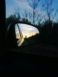 Reflection of car on side-view mirror