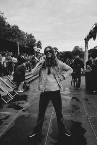 Rear view of woman standing on street