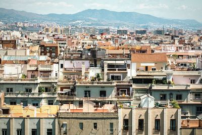 High angle view of townscape against mountain