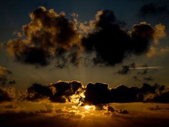 Low angle view of cloudy sky during sunset