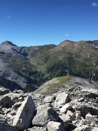 Scenic view of mountains against clear blue sky