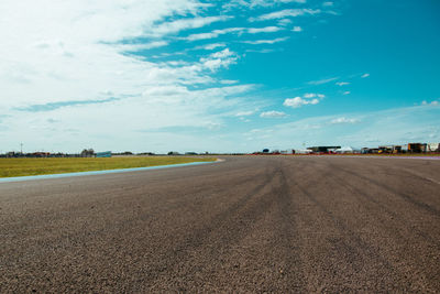 Scenic view of road against blue sky