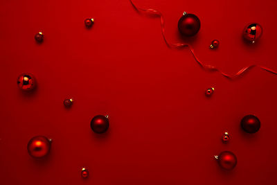 Full frame shot of water drops on red wall