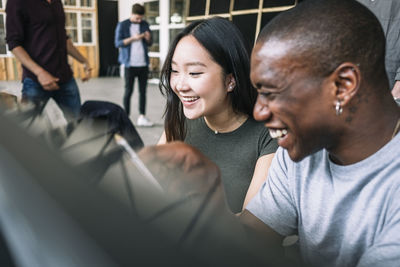 Cheerful multi-ethnic it professionals planning at creative office