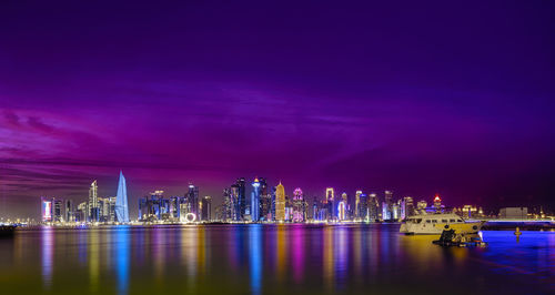 Illuminated buildings in city at night