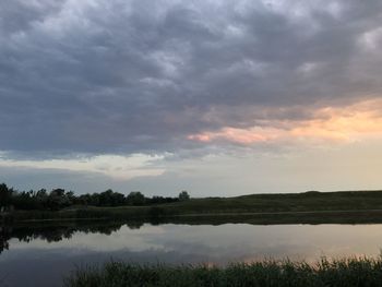 Scenic view of lake against sky during sunset