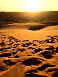 Scenic view of land against sky during sunset