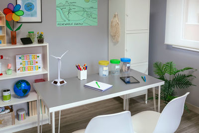 Environmental classroom with selective trash bins and windmill over table