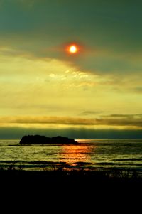 Scenic view of sea at sunset