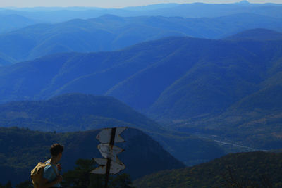 Rear view of man looking at mountains