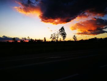 Silhouette landscape against sky during sunset