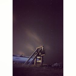 Scenic view of beach against sky at night