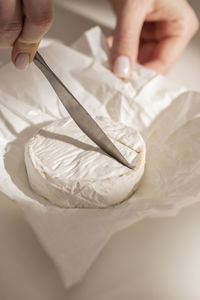 Cropped hand of person preparing food