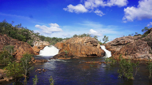 Panoramic view of sea and rocks against sky