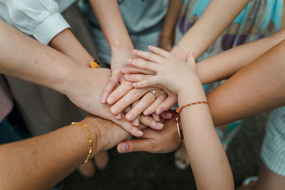 Midsection of woman holding hands together 