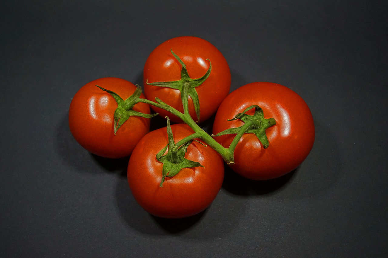 food, food and drink, tomato, healthy eating, plant, freshness, wellbeing, fruit, vegetable, red, produce, indoors, studio shot, no people, black background, close-up, gray, still life, group of objects, raw food, gray background, organic, ripe