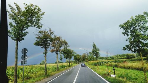 Road passing through field