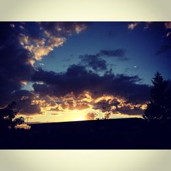 Scenic view of landscape against sky at sunset