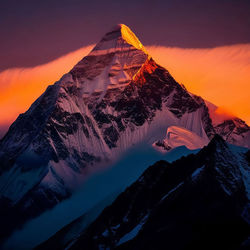 Scenic view of snowcapped mountains against sky during sunset