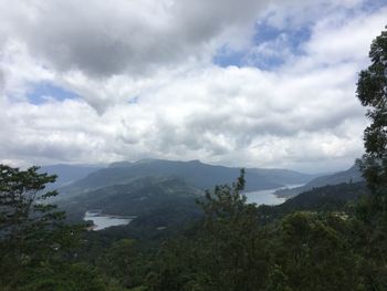 Scenic view of sea against cloudy sky
