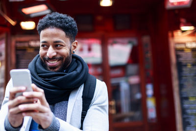 Portrait of young man photographing