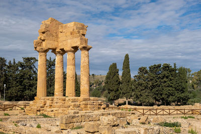 Old ruins of temple against cloudy sky