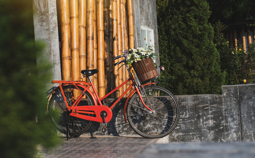 Bicycle parked against building