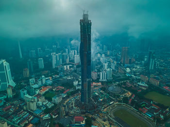 High angle view of modern buildings in city against sky