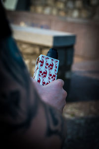 Close-up of hand holding umbrella