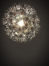 Low angle view of illuminated lights at night