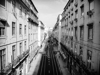 High angle view of railroad tracks amidst buildings in city