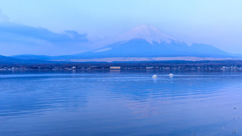 Scenic view of fuji mountain reflections on the sea in japan 