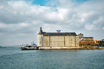 Old baraque style building of haydarpasa main train station in kadikoy istanbul with huge clouds