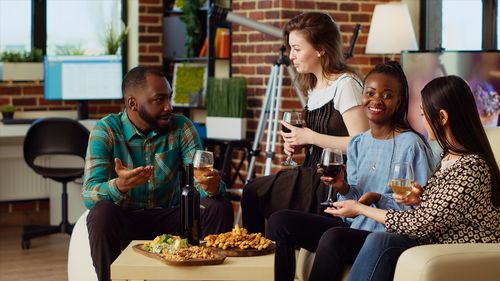 Female friends using mobile phone at restaurant