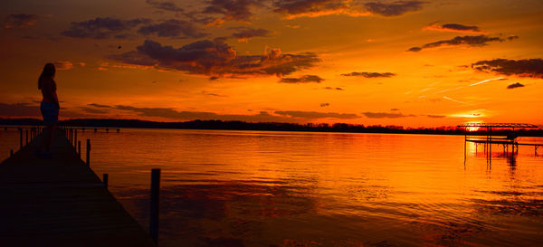 Scenic view of lake against sky during sunset