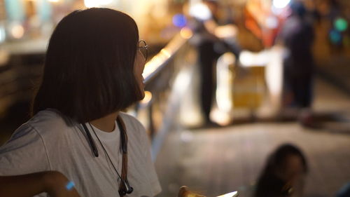 Midsection of asian woman looking away