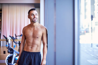 A portrait of a man resting at the gym.