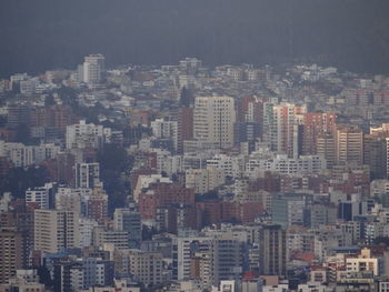 High angle view of buildings in city against sky