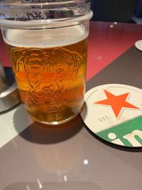 Close-up of beer glass on table
