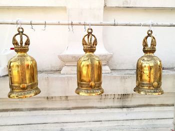 Close-up of metal against yellow wall