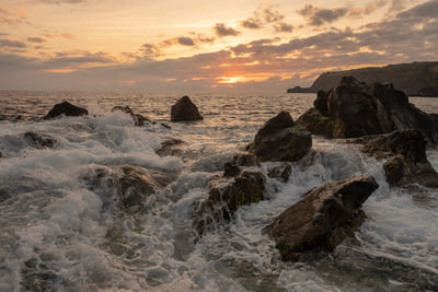 Scenic view of sea against sky during sunset