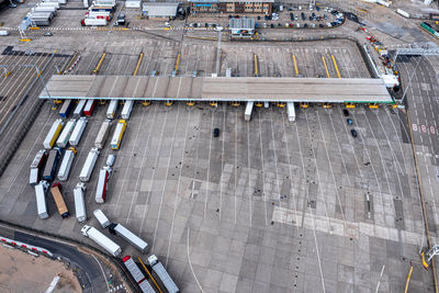 Aerial view of harbor and trucks parked along side each other in dover, uk.